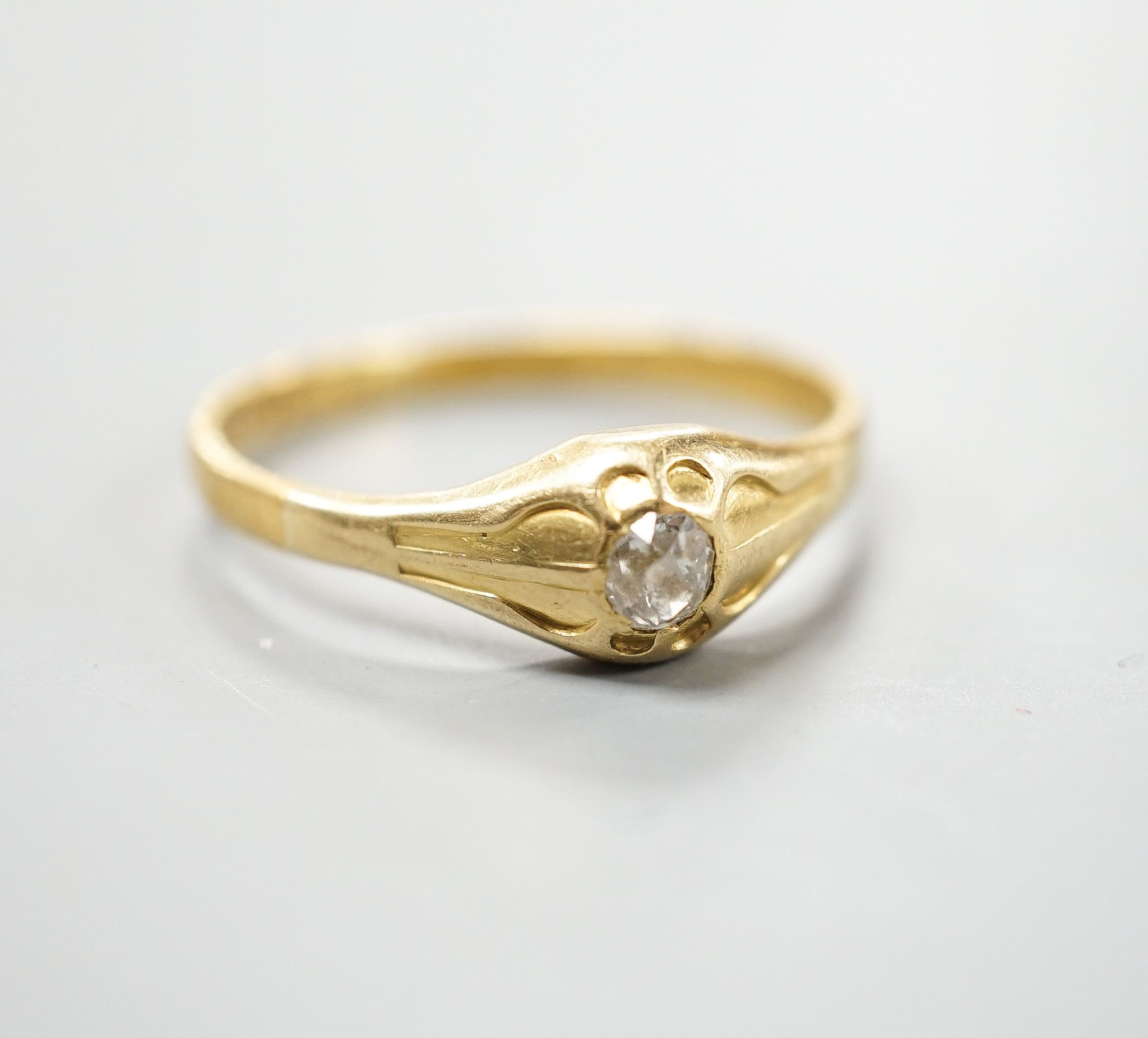A Victorian 22ct gold and solitaire diamond set ring, London, 1875, size Z, gross weight 5 grams
